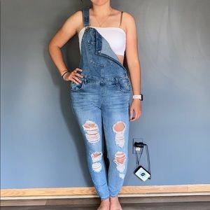 Frayed jean overalls